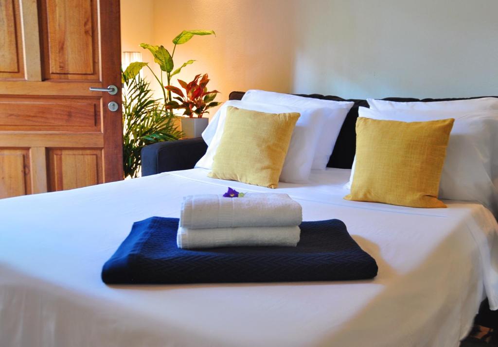 Un pat sau paturi într-o cameră la Pazifico Villas