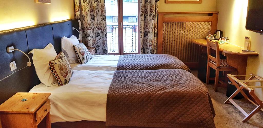 Postel nebo postele na pokoji v ubytování Park Hotel Suisse & Spa