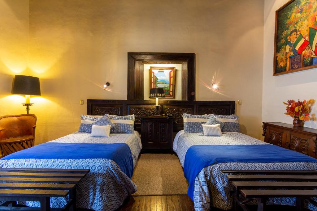 Postel nebo postele na pokoji v ubytování Hotel Mansion Iturbe