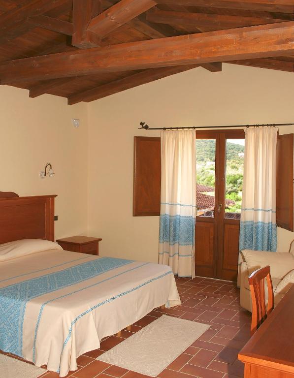 Postel nebo postele na pokoji v ubytování Hotel Giardino Corte Rubja