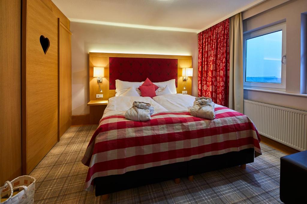 Postel nebo postele na pokoji v ubytování Hotel Rimberg