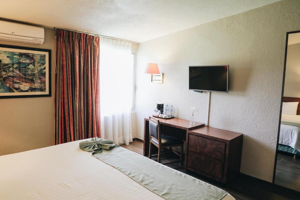 TV a/nebo společenská místnost v ubytování Hotel La Joya Tulancingo