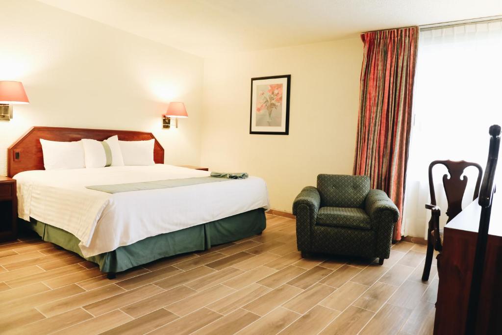 Postel nebo postele na pokoji v ubytování Hotel La Joya Tulancingo
