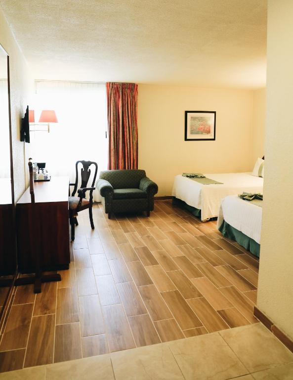 Postel nebo postele na pokoji v ubytování Hotel La Joya Tulancingo