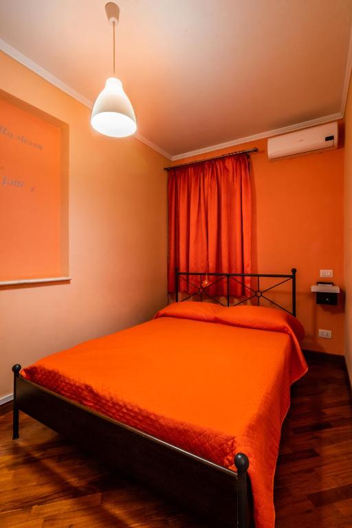 Postel nebo postele na pokoji v ubytování Il Bacio e La Nocciola