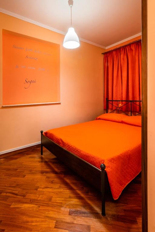 Postel nebo postele na pokoji v ubytování Il Bacio e La Nocciola
