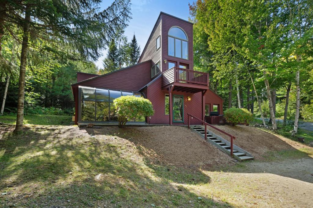 a home in the woods with a large yard at Cow Hill Haven in Bartlett