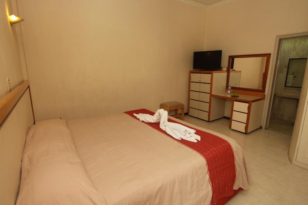 Postel nebo postele na pokoji v ubytování Hotel Ferri