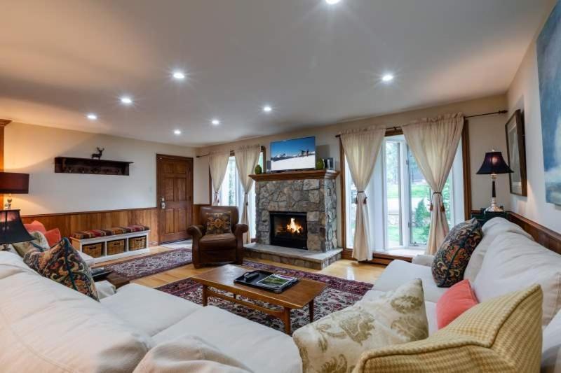 a living room with a couch and a fireplace at Texas Townhome Minutes to Gondola in Vail