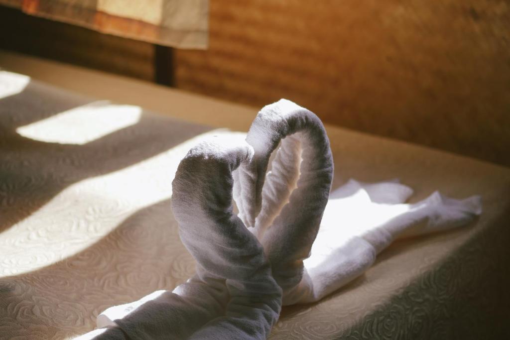 Postel nebo postele na pokoji v ubytování Phuruarounmai Organic Living Resort