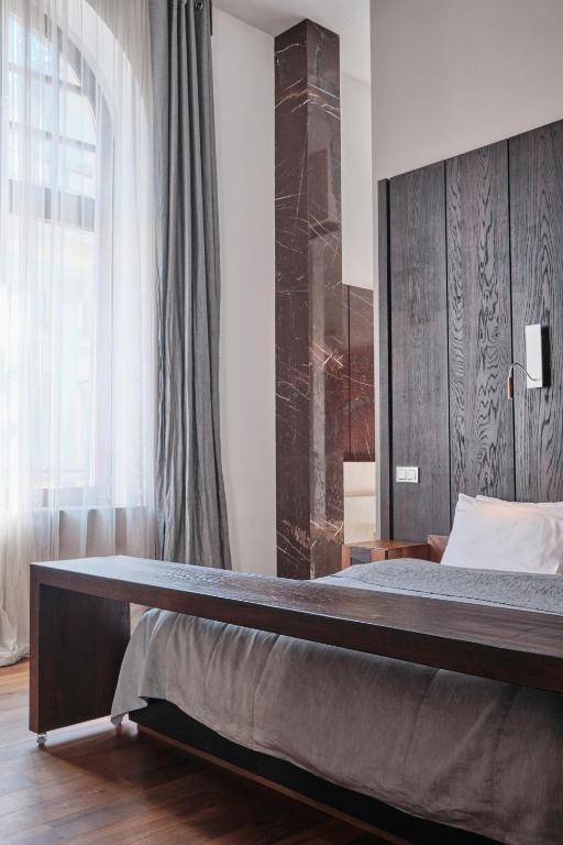 Postel nebo postele na pokoji v ubytování Hotel Monopol