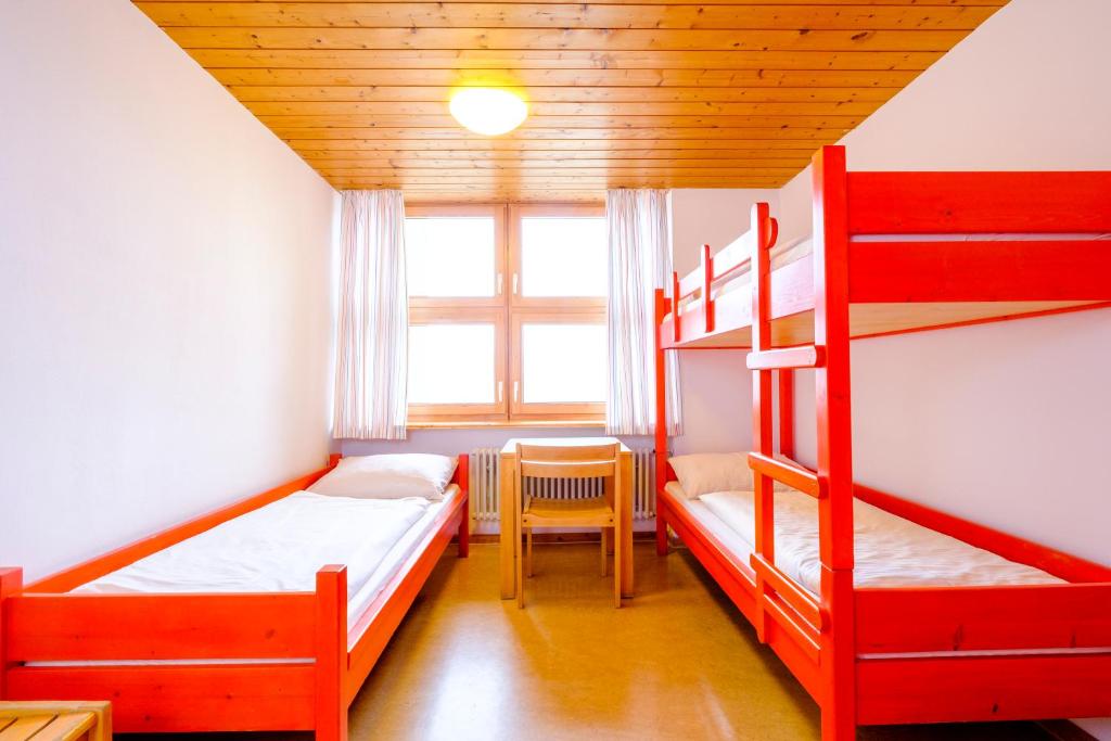 Postel nebo postele na pokoji v ubytování DJH Jugendherberge Pottenstein