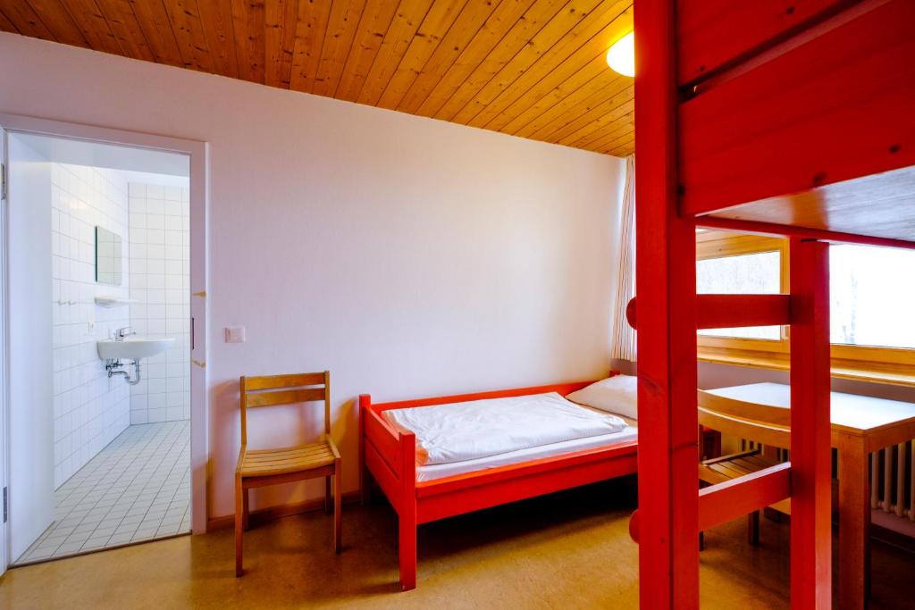 Postel nebo postele na pokoji v ubytování DJH Jugendherberge Pottenstein