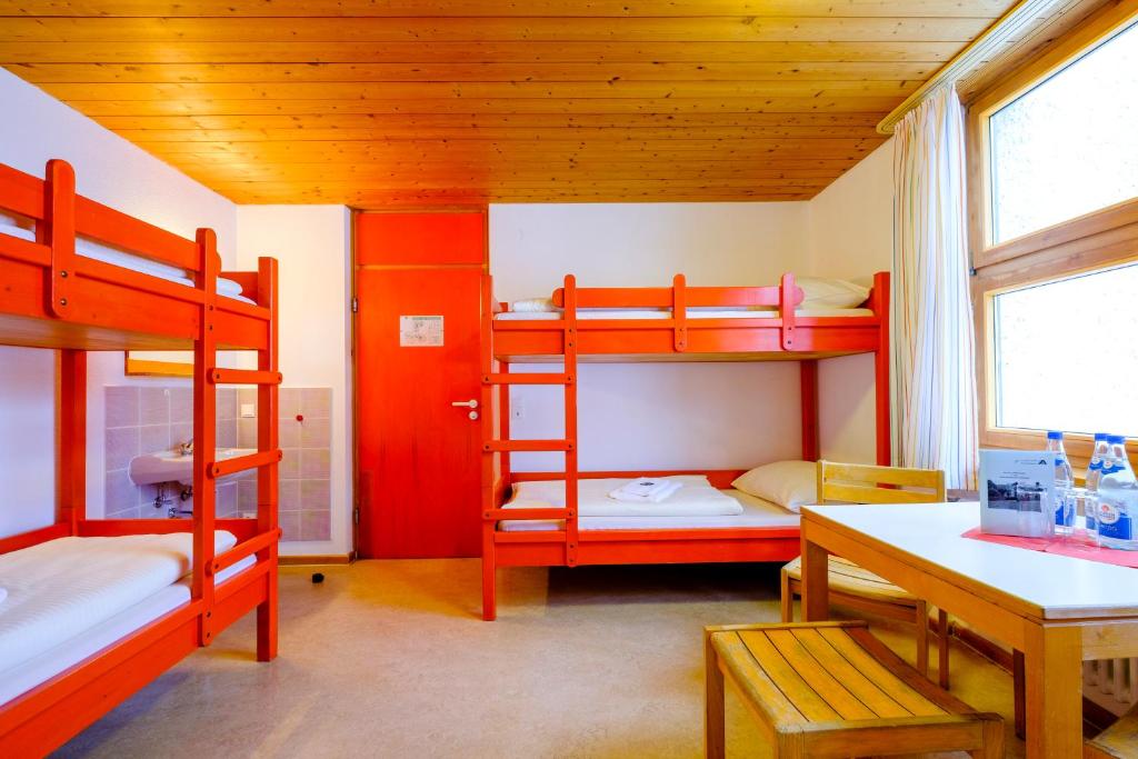 Postel nebo postele na pokoji v ubytování DJH Jugendherberge Pottenstein