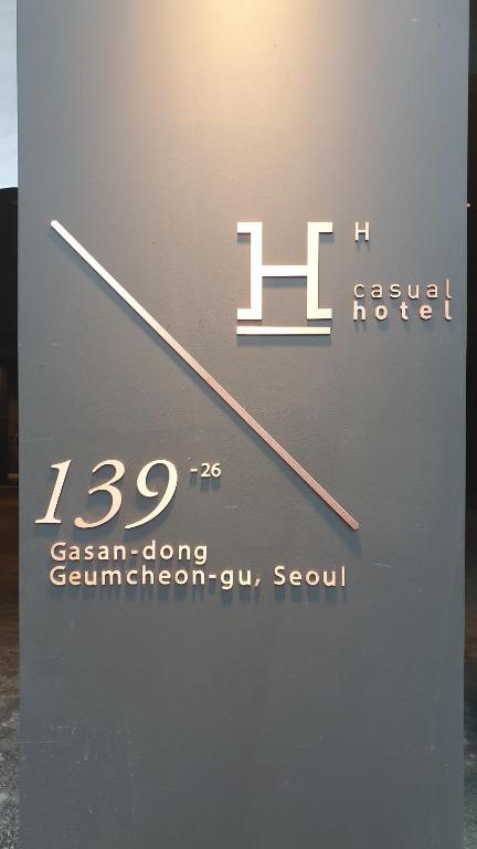 a sign that says h lason cluing germanorensur seventh at H hotel Gasan in Seoul