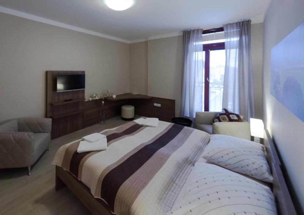 Postel nebo postele na pokoji v ubytování Penzion Apartmány Resident