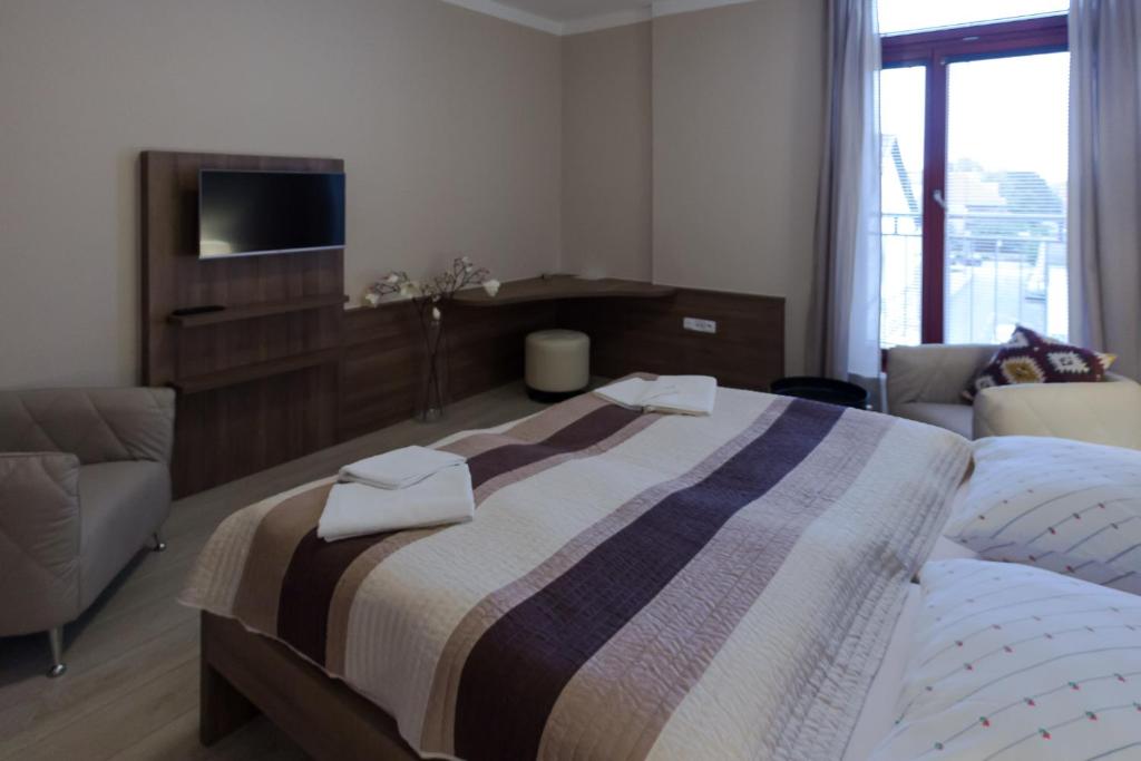 Postel nebo postele na pokoji v ubytování Penzion Apartmány Resident