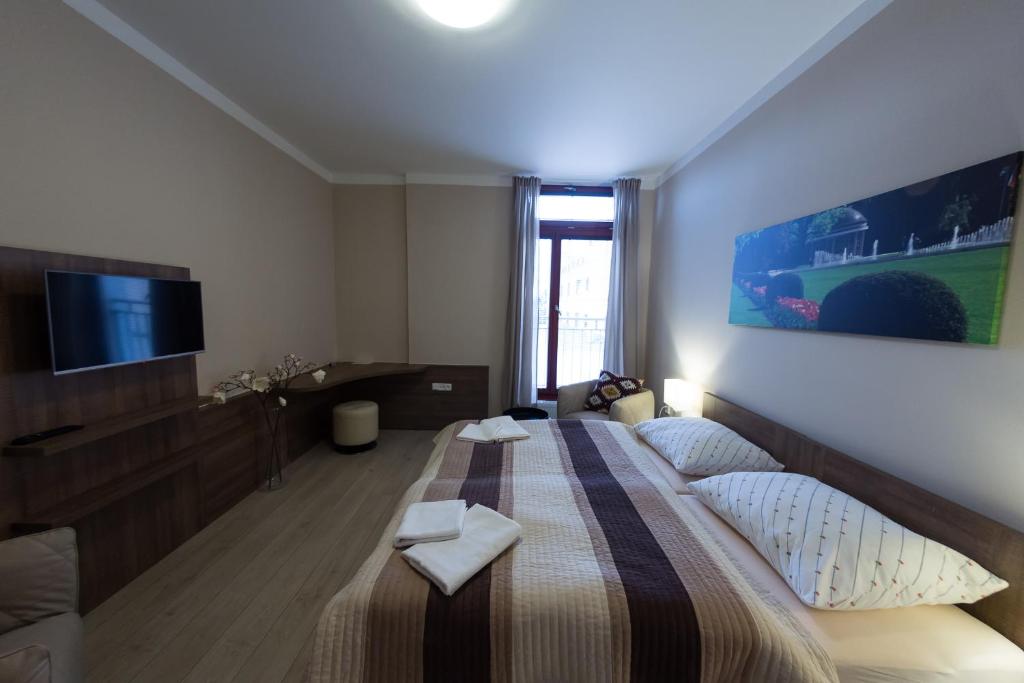Postel nebo postele na pokoji v ubytování Penzion Apartmány Resident