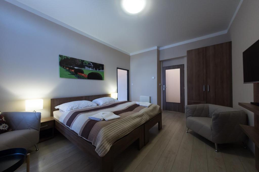 Postel nebo postele na pokoji v ubytování Penzion Apartmány Resident