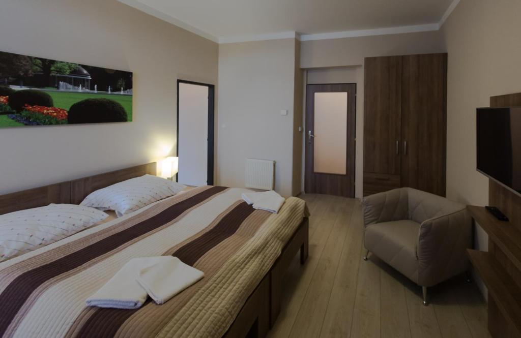 Postel nebo postele na pokoji v ubytování Penzion Apartmány Resident
