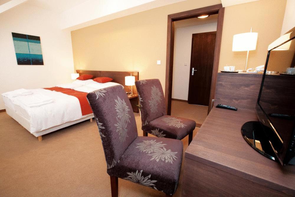 Postel nebo postele na pokoji v ubytování Hotel Peklo