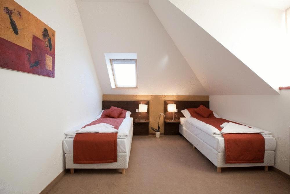 Postel nebo postele na pokoji v ubytování Hotel Peklo