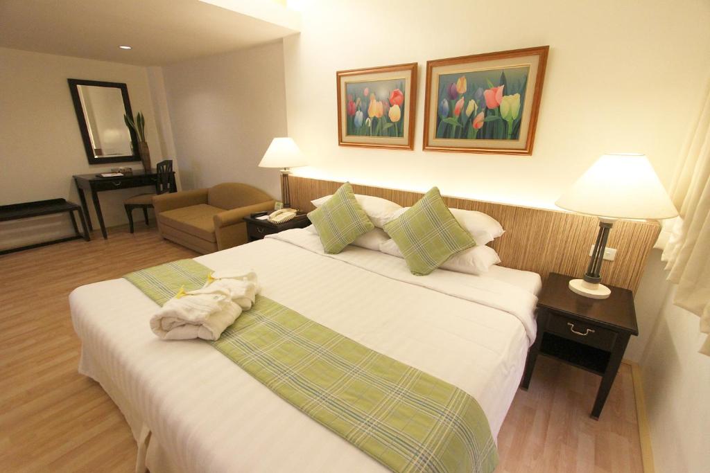 Postel nebo postele na pokoji v ubytování Hotel Fleuris