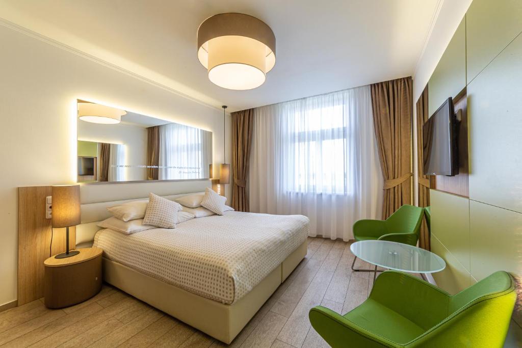 Postel nebo postele na pokoji v ubytování Salvator Boutique Hotel vegan-friendly