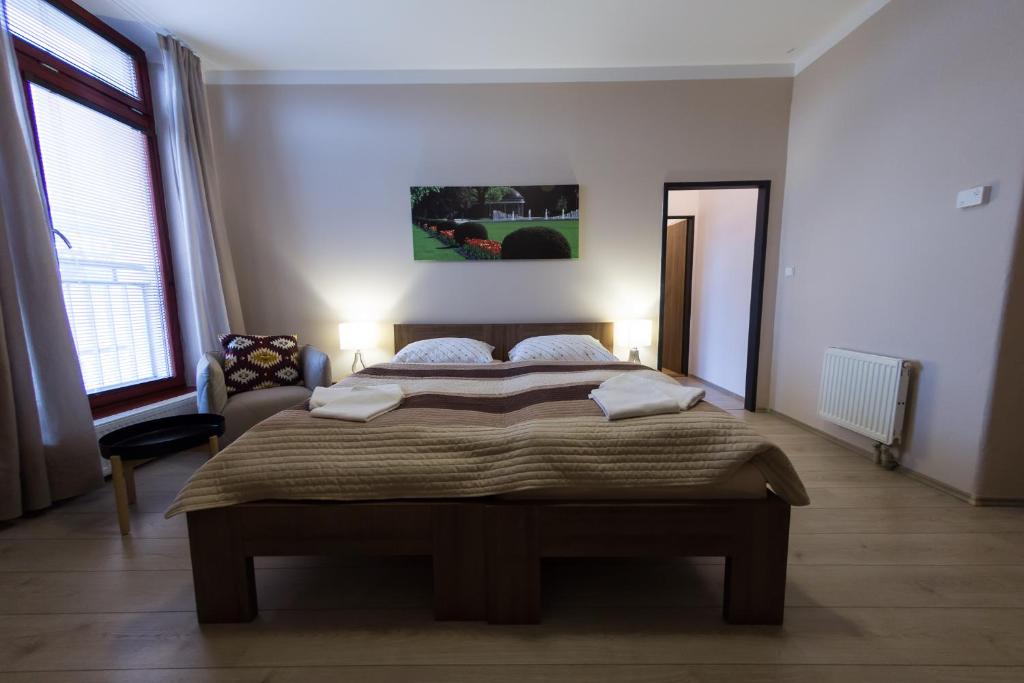 Postel nebo postele na pokoji v ubytování Penzion Apartmány Resident
