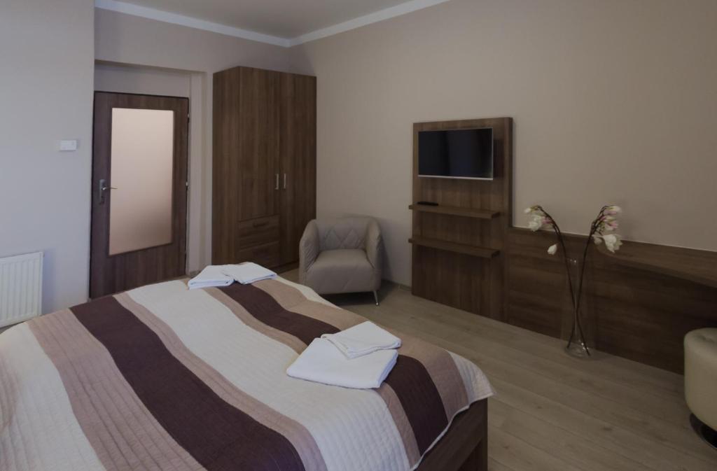 Postel nebo postele na pokoji v ubytování Penzion Apartmány Resident