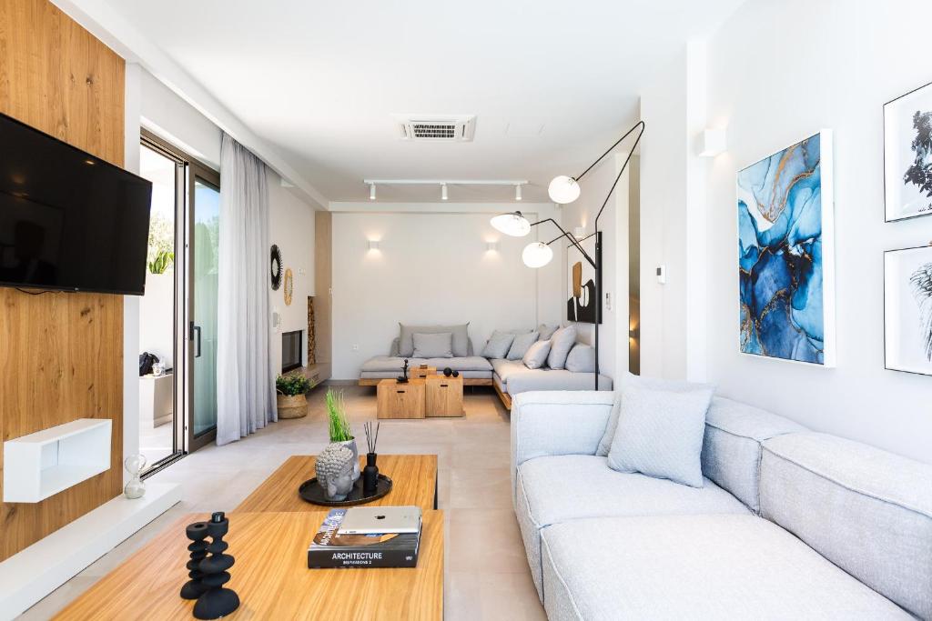 A seating area at Vasilios Villa, with Pool, Gym & Close to Beach, By ThinkVilla