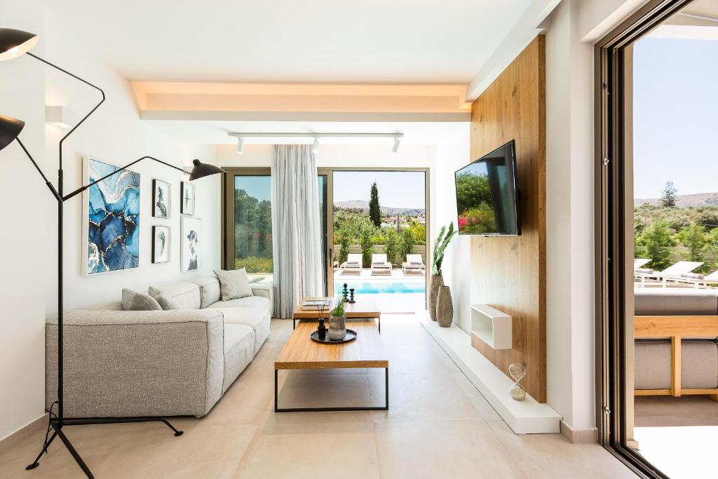 A television and/or entertainment centre at Vasilios Villa, with Pool, Gym & Close to Beach, By ThinkVilla