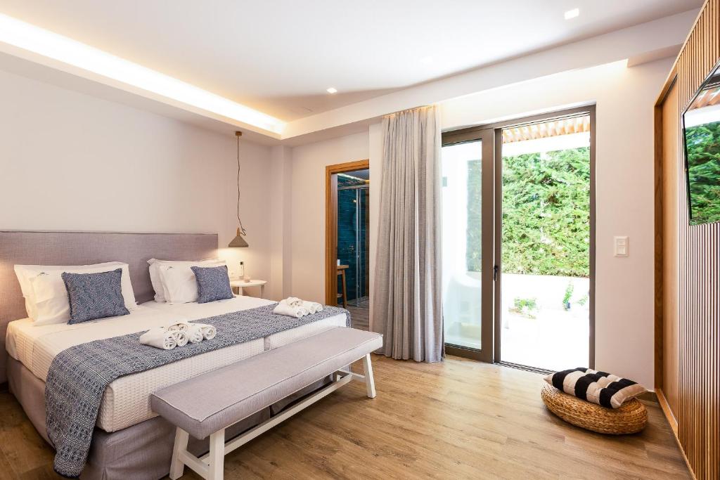 A bed or beds in a room at Vasilios Villa, with Pool, Gym & Close to Beach, By ThinkVilla
