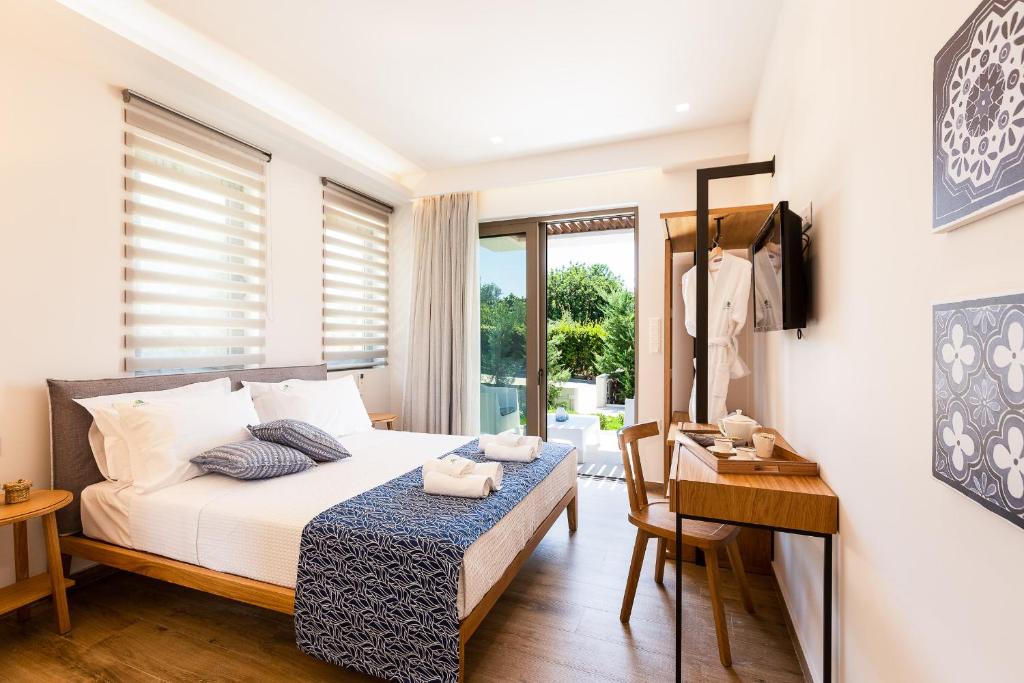 A bed or beds in a room at Vasilios Villa, with Pool, Gym & Close to Beach, By ThinkVilla