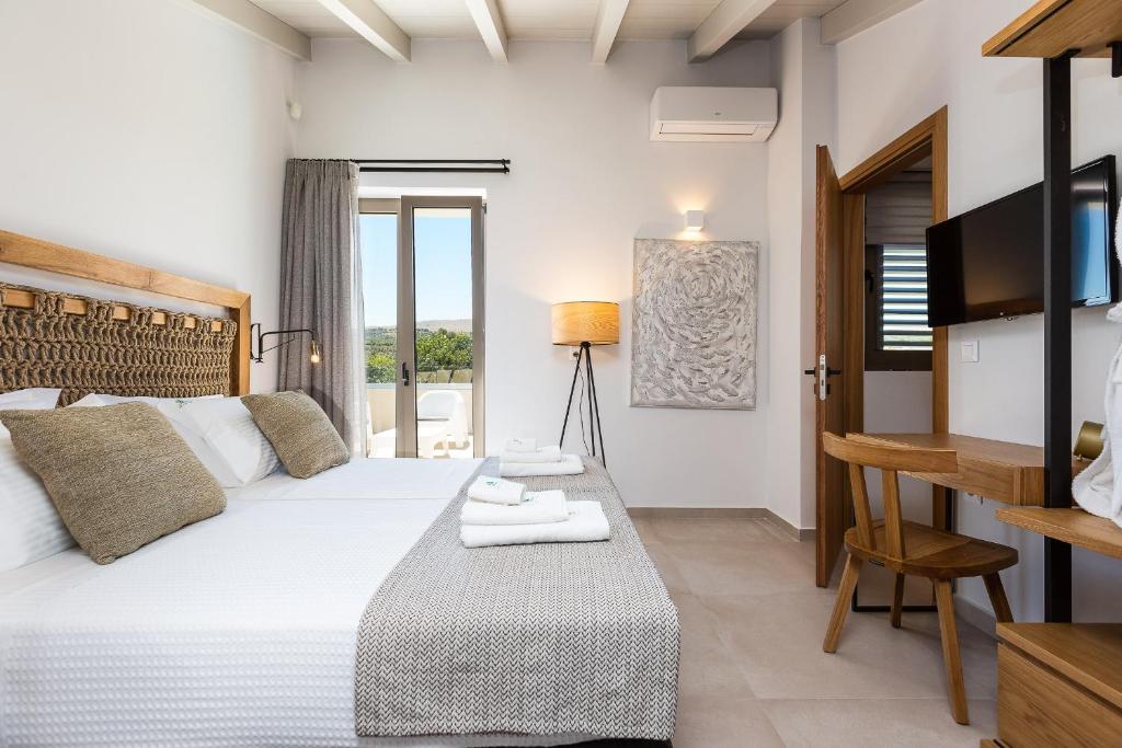 A bed or beds in a room at Vasilios Villa, with Pool, Gym & Close to Beach, By ThinkVilla