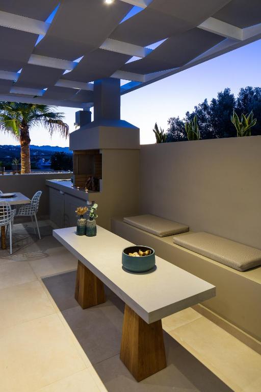 A seating area at Vasilios Villa, with Pool, Gym & Close to Beach, By ThinkVilla