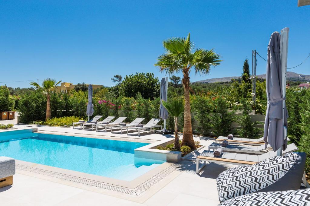 The swimming pool at or close to Vasilios Villa, with Pool, Gym & Close to Beach, By ThinkVilla