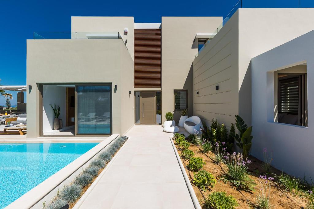 The swimming pool at or close to Vasilios Villa, with Pool, Gym & Close to Beach, By ThinkVilla