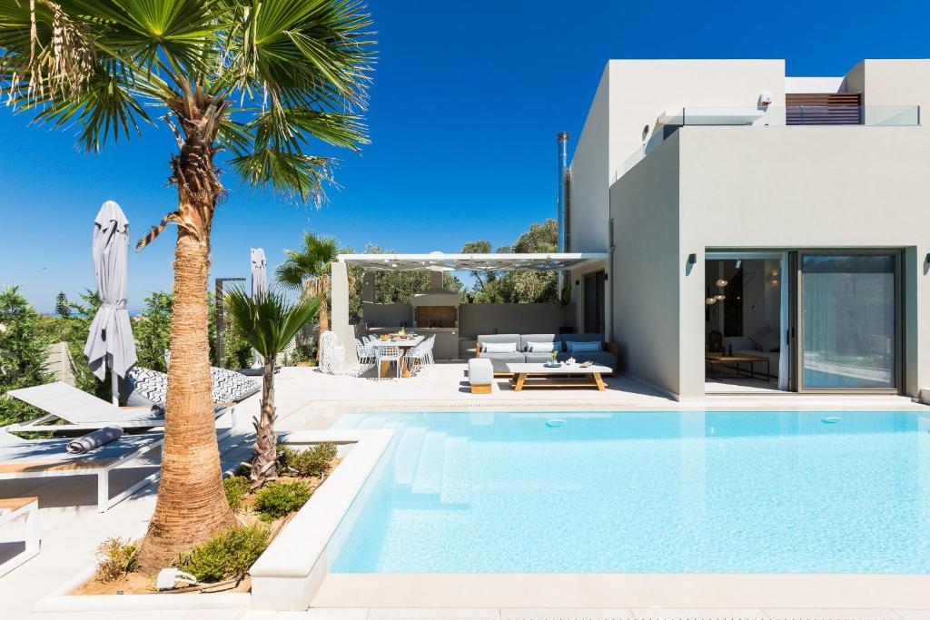 The swimming pool at or close to Vasilios Villa, with Pool, Gym & Close to Beach, By ThinkVilla