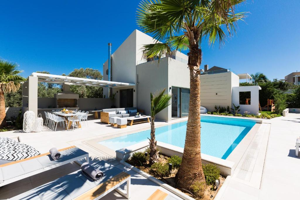 The swimming pool at or close to Vasilios Villa, with Pool, Gym & Close to Beach, By ThinkVilla