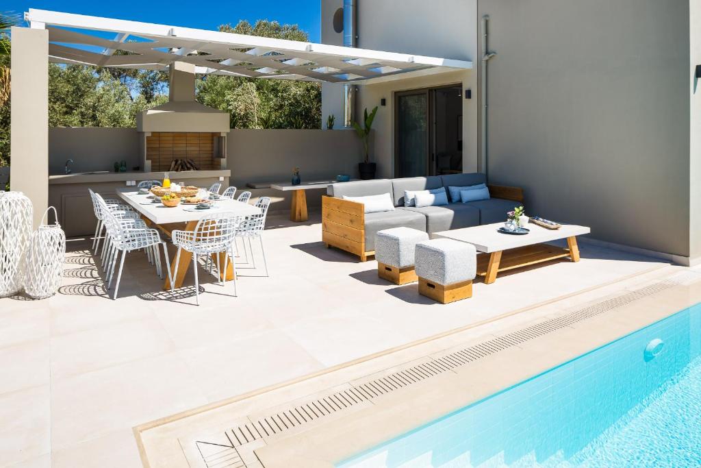 The swimming pool at or close to Vasilios Villa, with Pool, Gym & Close to Beach, By ThinkVilla