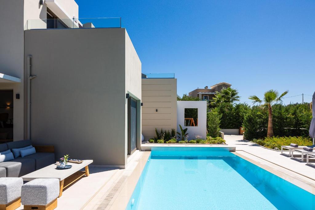 The swimming pool at or close to Vasilios Villa, with Pool, Gym & Close to Beach, By ThinkVilla