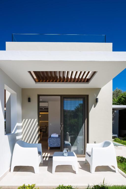 A seating area at Vasilios Villa, with Pool, Gym & Close to Beach, By ThinkVilla