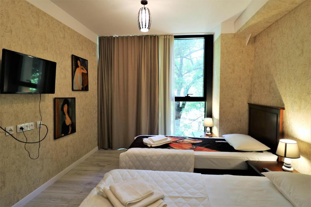 Postel nebo postele na pokoji v ubytování Hotel Liberty Theatre
