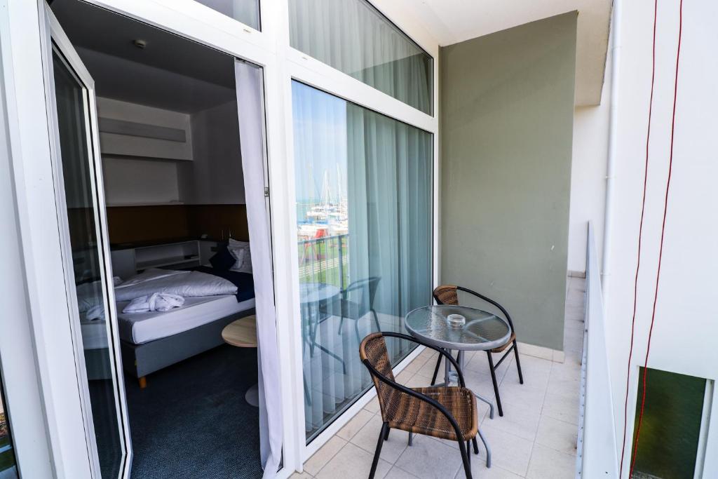Posteľ alebo postele v izbe v ubytovaní Hotel Yacht Wellness & Business