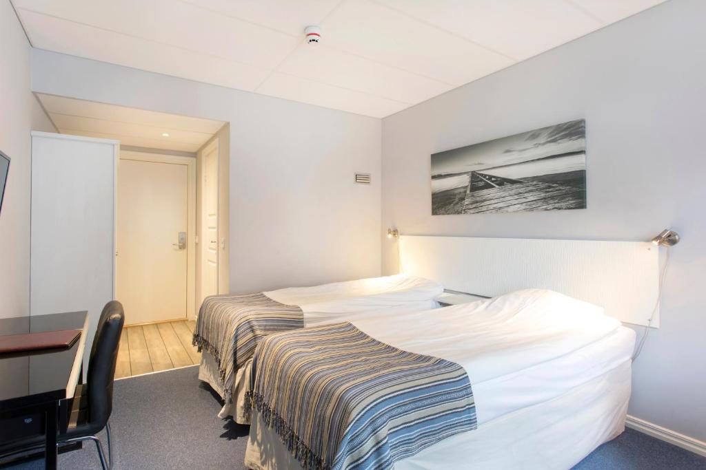 Postel nebo postele na pokoji v ubytování Skärgårdshotellet