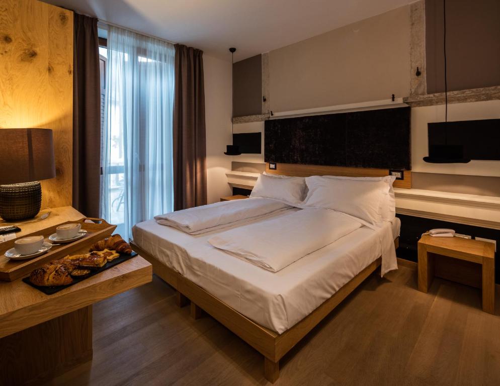 Postel nebo postele na pokoji v ubytování Albergo Caffe Centrale