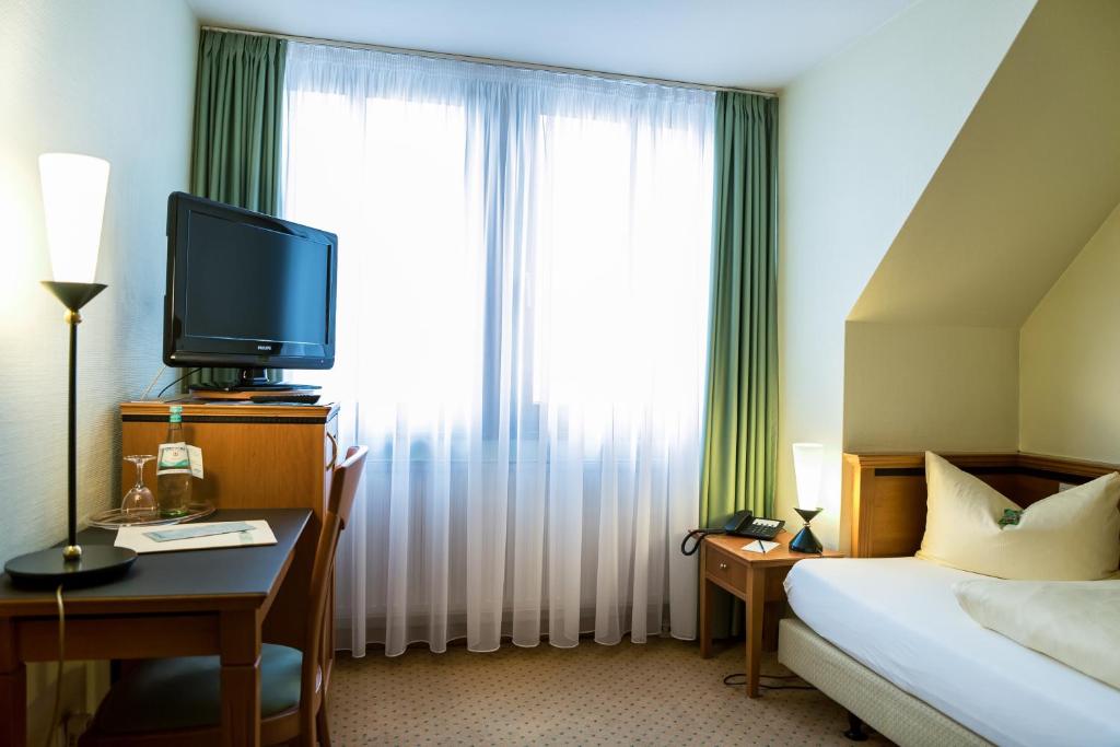 Postel nebo postele na pokoji v ubytování Ringhotel Dreiländereck Zittau