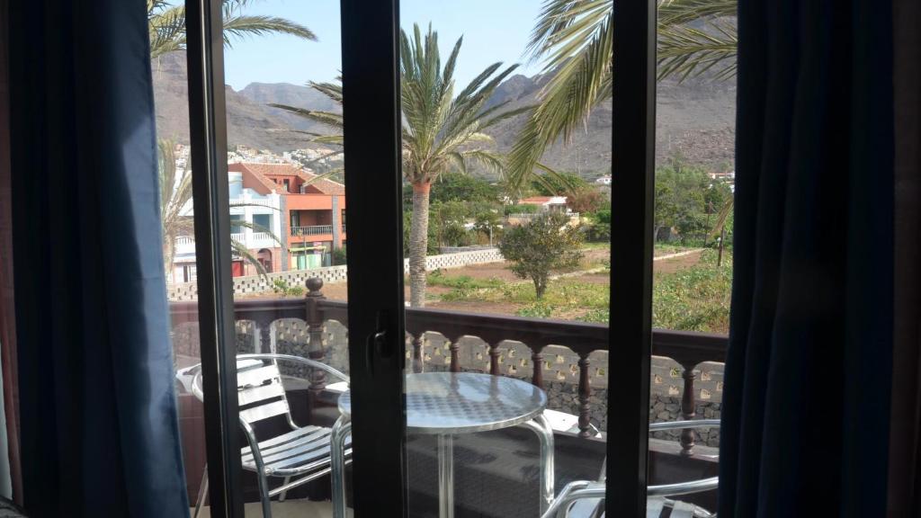 a view of a table and chairs from a balcony at El Bajio Nr 7 in Valle Gran Rey