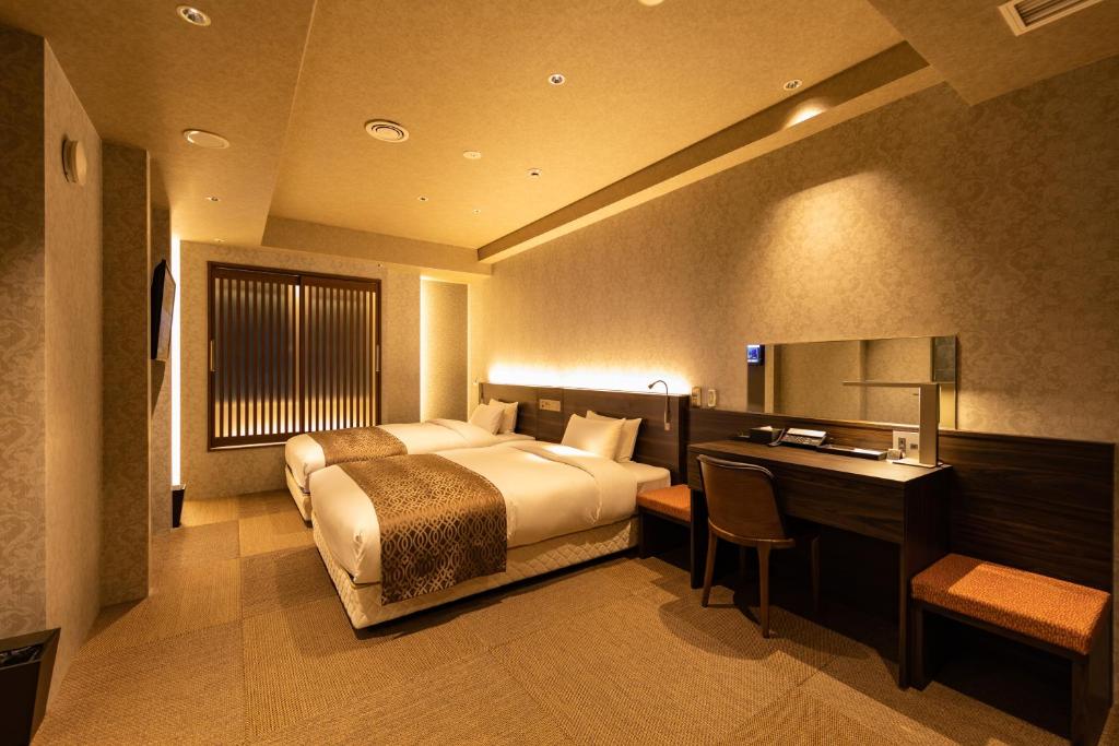 Postel nebo postele na pokoji v ubytování Piazza Hotel Nara